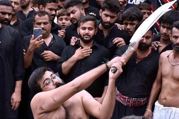 Mourners Touch Zuljinah During The Main Procession Of 9th Muharram Ul