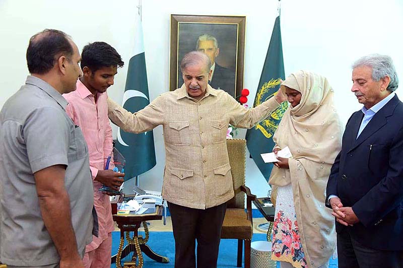 Prime Minister Muhammad Shehbaz Sharif Presenting A Cheque Of Million