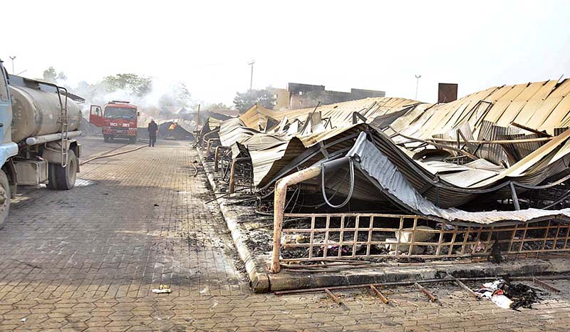 Firefighters busy in operation to extinguish fire after yesterday’s fire erupts in weekly bazaar at H-9 Peshawar Morr