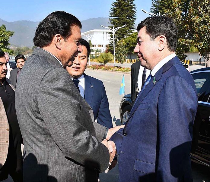 Speaker National Assembly Raja Pervez Ashraf receiving Chairman Mazhilis of the Parliament of Kazakhstan Yerlan Koshanov on his arrival at Parliament House