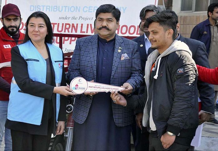 Chairman PRCS, Sardar Shahid Ahmed Laghari presenting Rickshaws key to the participant during the launching ceremony of “Post Livelihood Support to Returnees from Turkey