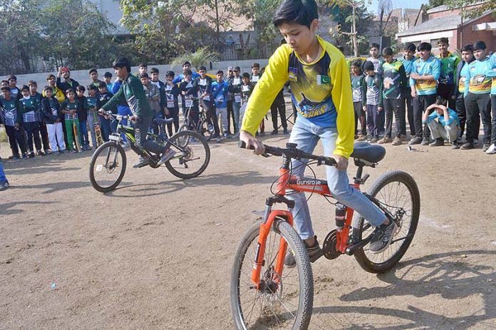 Students are participating in slow cycle race during Dar-E-Arqam School Sports Gala