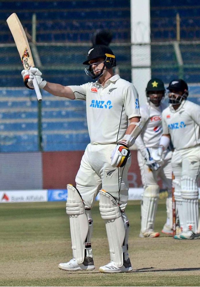 New Zealand's batsman Matt Henry celebrates after scoring half century (50 runs) during the second day of the second cricket test match between Pakistan and New Zealand at National Stadium