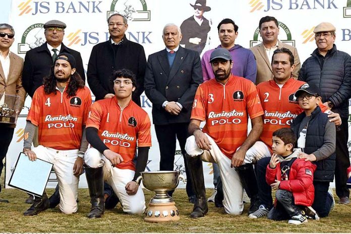 Gen. Jehangir Karamat (Retd) in a group photo with the players of Platinum Homes Polo team after winning final of Maj. Gen. Saeed-uz-Zaman Janjua Memorial Polo Cup 2023 sponsored by JS Bank at Jinnah Polo Fields