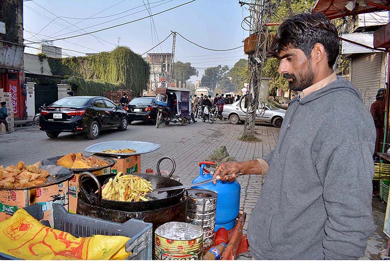 An old man vendor pulling his cart moving towards his destination