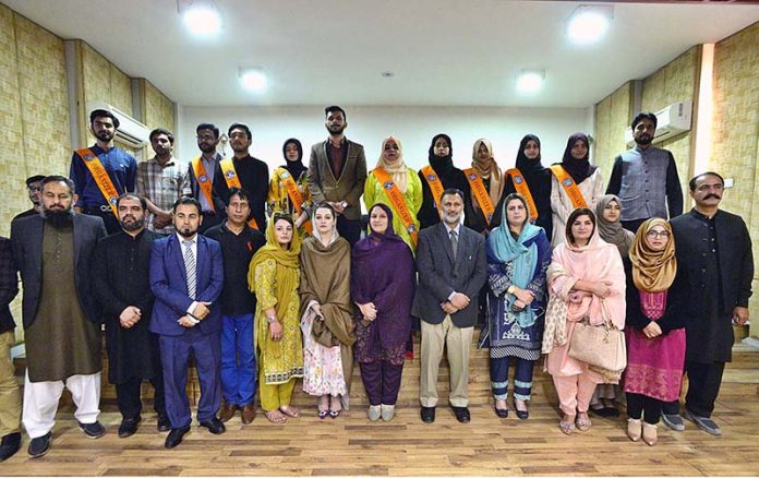 Chairperson Peace & Culture Organization Mushaal Hussein Mullick the wife of Jailed Kashmiri Hurriyat Leader Mohammad Yasin Malik in a group photo with participants of the seminar on 