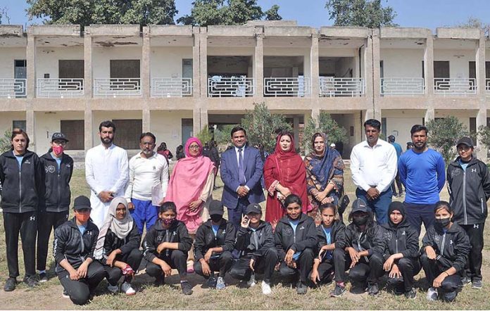 A group photo of Secretary Education Board Sargodha Dr Mohsin Abbas and Director Physical Education Roshan Zameer with players during inter-collegiate cricket tournament organized by Sargodha Education Board