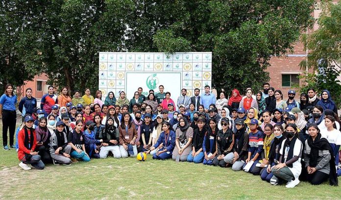 A group photo of players with GCWUF Vice Chancellor Professor Dr. Rubina Farooq after inaugurating the Talent Hunt Youth Sports Volleyball for selection Trials for Women under the Prime Minister's Youth Program at Government College Women University Faisalabad (GCWUF) Ground