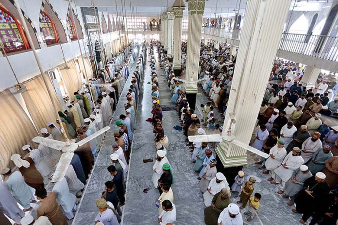 A large number of faithful offering Namaz-e-Jumma prayers during Holy ...