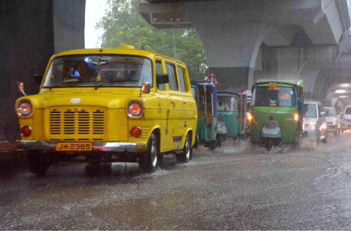 Commuters traveling during heavy rainfall