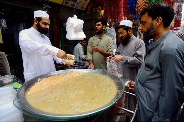 Vendor selling traditional sweet dish 