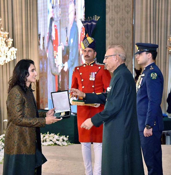 President Dr. Arif Alvi conferring the Pakistan Civil Award of Tamgha-i-Imtiaz upon Ms. Bisma Maroof in recognition of her services in the field of Sports (Cricket) at the Investiture Ceremony on Pakistan Day, held at Aiwan-e-Sadr