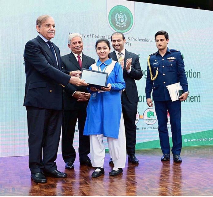 Prime Minister Muhammad Shehbaz Sharif distributes chrome books among the students as part of TeleSchool Pakistan and Google for Education programme