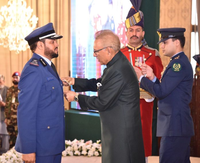 President Dr Arif Alvi conferring the award of Hilal-i-Imtiaz (Military) upon the Defense Attache of the Kingdom of Saudi Arabia in Pakistan, Major General (Pilot) Staff, Awad bin Abdullah Al-zahrani, at Aiwan-e-Sadr, Islamabad, on 24-03-2023.