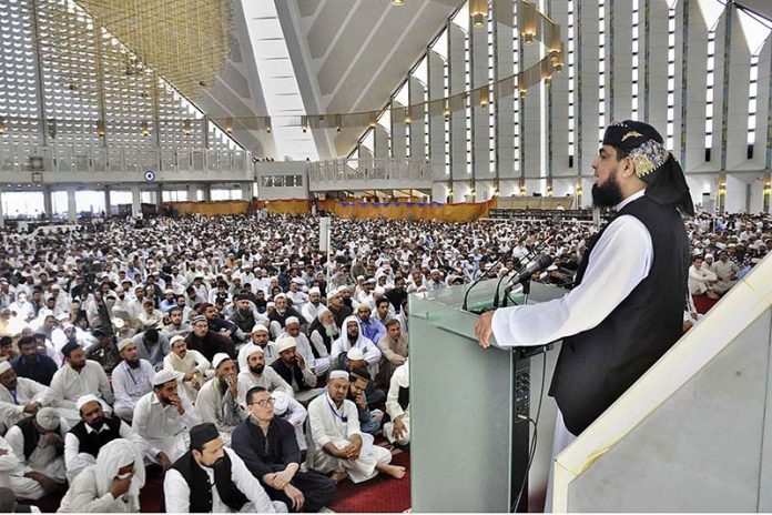 A religious scholar deliver Jumma Khutbah (sermon) at Faisal Masjid ...