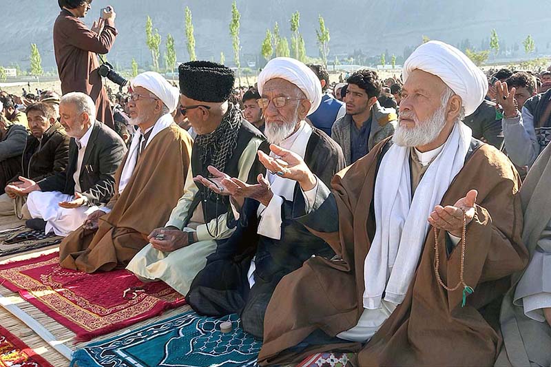 A large number of faithful offering Eid-ul-Fitr prayer at Eidgah Skardu