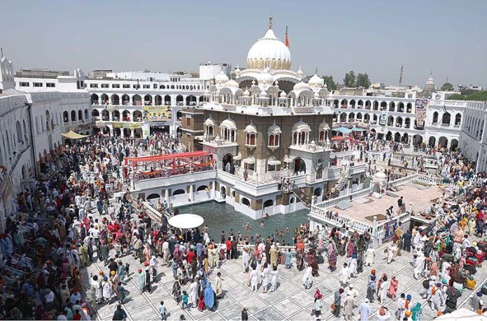 Thousands of Sikh pilgrims performing their ritual during Baisakhi harvest festival, with the main ceremony of the New Year's celebration of Sikh community at their Holy Shrine Panja Sahib in Hasan Abdal some 50km NW of Islamabad.