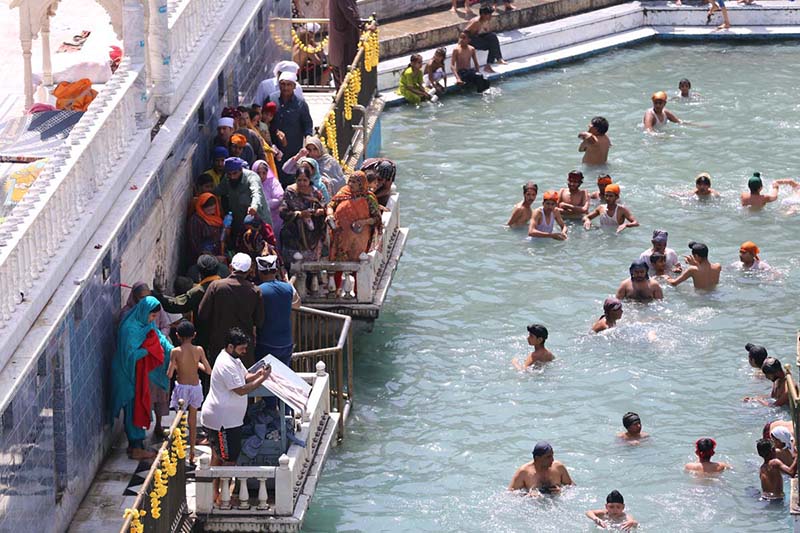 Thousands of Sikh pilgrims performing their ritual during Baisakhi harvest festival, with the main ceremony of the New Year's celebration of Sikh community at their Holy Shrine Panja Sahib in Hasan Abdal some 50km NW of Islamabad.