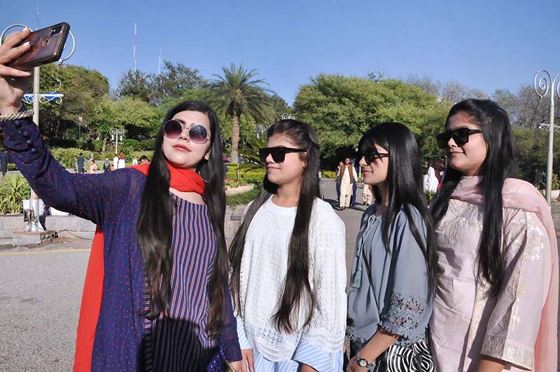 Women walk at the picnic point Daman e Koh during celebrate the 2nd day of Eid ul Fitr