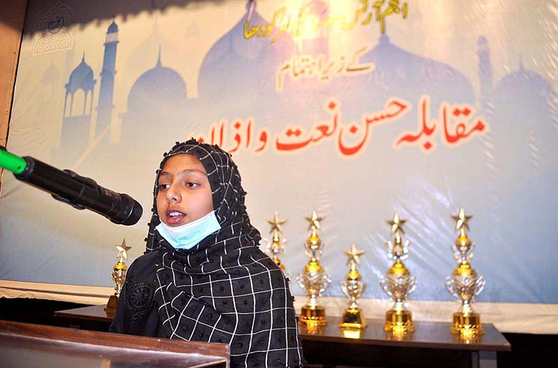 A boy reciting Naat during Azan and Naat competition organized by Anjam Art Society.