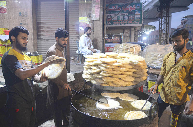 A vendor is cooking vermicelli fiona during holy month of Ramadan