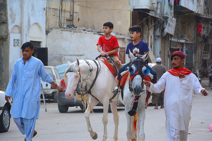 Children enjoy horse riding before Iftar at Pakistan Chowk