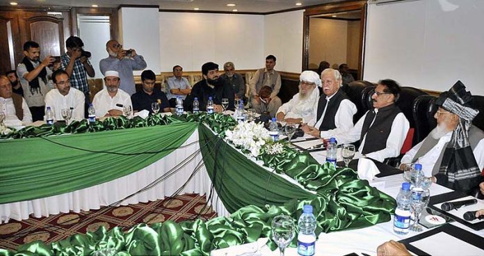 Ex-Federal Minister Anwar Saifullah Khan addressing a press conference during the 