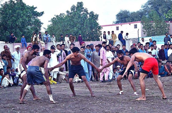 A view of the Kabaddi match played between Cheetah Club versus Jahanian club during the international kabaddi takara at Chak 13 Faiz