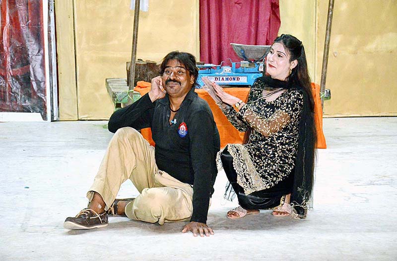 Artists performing on stage in drama "kalu kasai" presented by Arts Council of Pakistan at ZA Bhutto Open Air Theater