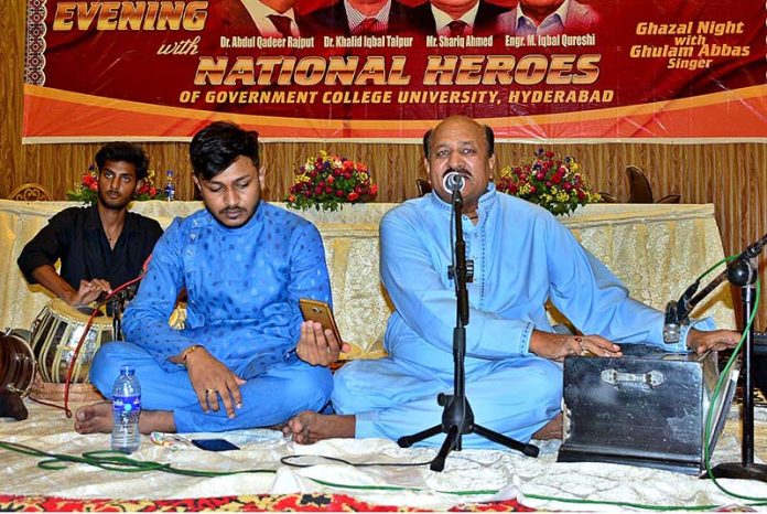 Renowned singer Ghulam Abbas singing a national song on stage during Grand Evening Program with National Heroes produced by GC University, Hyderabad at Mehran Art Council