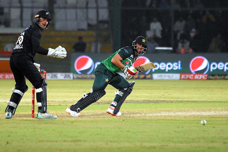 Pakistan's batsman Agha Salman celebrates after scoring a half-century (50 runs) during 5th and final One-Day International (ODI) cricket match between Pakistan and New Zealand teams at the National Stadium