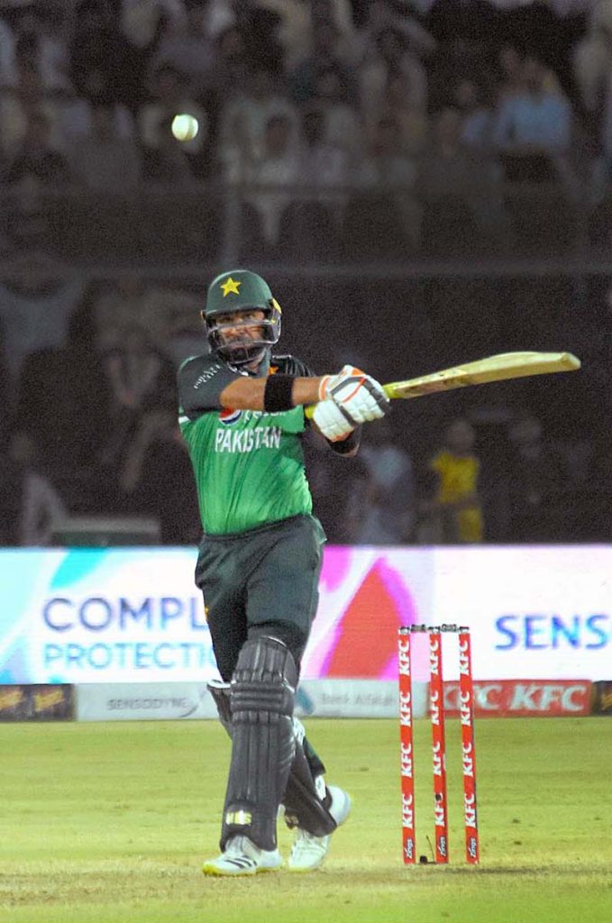 Pakistan's batsman Agha Salman celebrates after scoring a half-century (50 runs) during 5th and final One-Day International (ODI) cricket match between Pakistan and New Zealand teams at the National Stadium