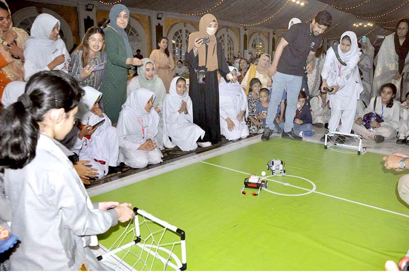 A student visits a science stall at the closing session of International EdTech Conference