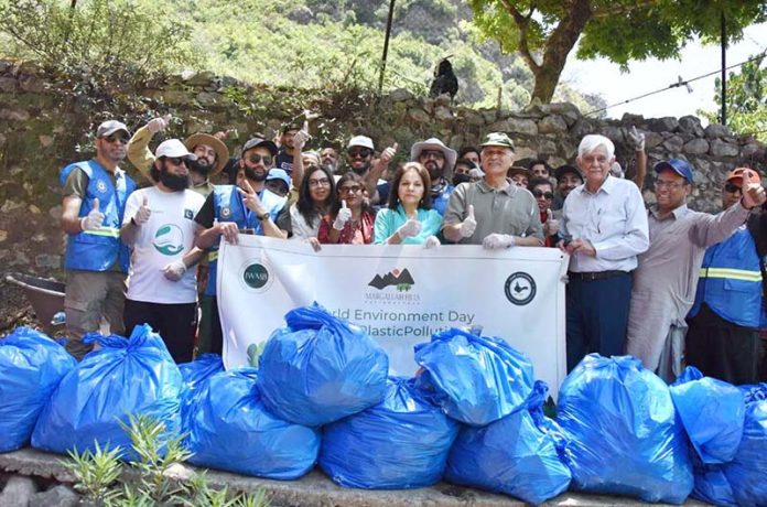 Chairman Senate Standing Committee on Climate Change Senator Seemee Ezdi in a group photograph with participants during a cleanliness drive at the Shahdara Margalla Hills National Park to commemorate World Environment Day on June 5th