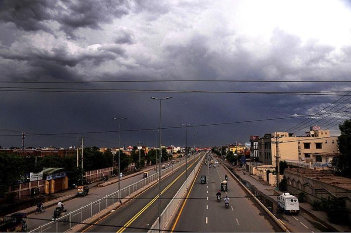 After the rain in the city, a captivating sight unfolds as dark clouds hover over the sky, creating a dramatic and alluring atmosphere