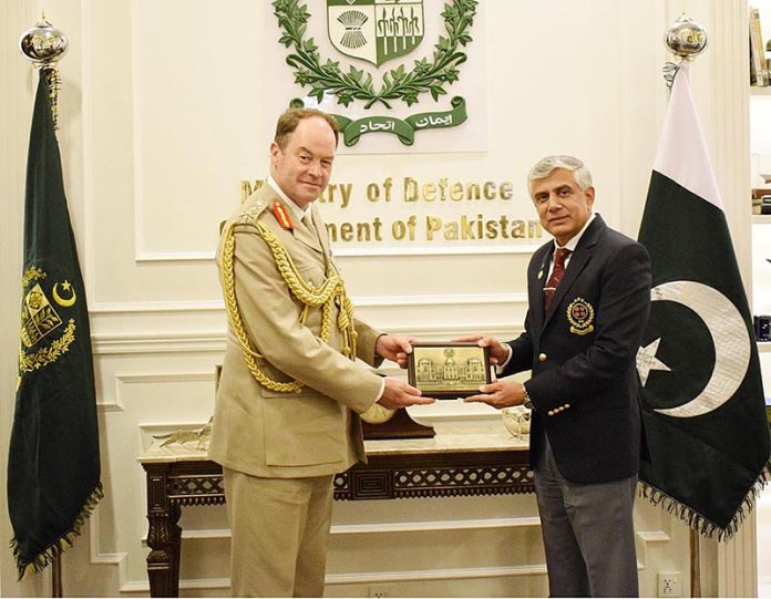 Secretary Defence, Lt Gen (Retd) Hamood Uz Zaman Khan presenting a gift to General Sir Patrick Nicholas, British Army chief of the General Staff, in Ministry of Defence