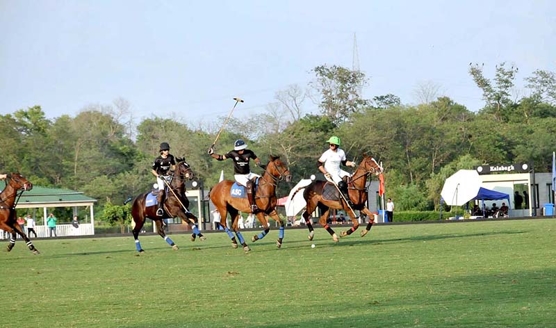 Players struggling to get control on the ball during a Juinor Polo ...