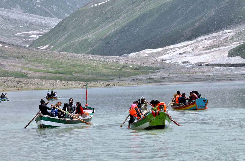 The beautiful view of Lake Saif ul malook with clouds hovering over the mountains