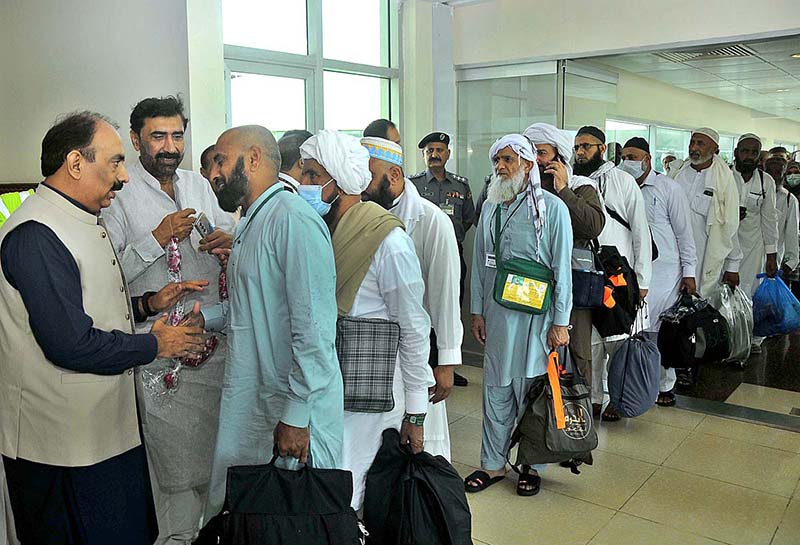 Pilgrims coming out from the airport as First Hajj flight landed after
