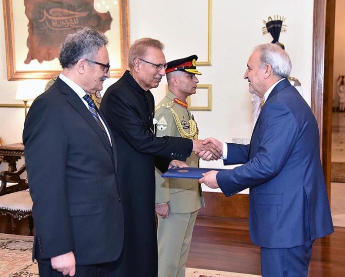 The Ambassador-designate of the Islamic Republic of Iran to Pakistan Dr. Reza Amiri Moghaddam presenting his diplomatic credentials to President Dr. Arif Alvi at Aiwan-e-Sadr