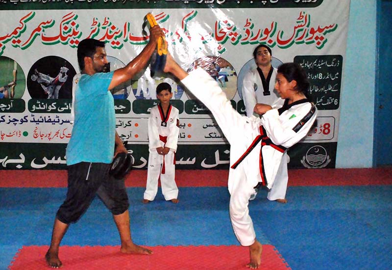 Youngsters participating taekwondo in Coaching and Training Summer Camp at Bahawalpur Stadium organized by Sports Board Punjab for U-8 to U-14