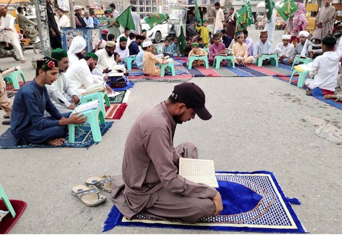 Workers of Jamaat Ahle Sunnat busy in reciting Holy Quran during protest demonstration at jinnah bagh chowk against the burning of Holy Quran outside a Stockholm Mosque in Sweden.