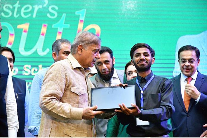 Prime Minister Muhammad Shehbaz Sharif distributes laptops among the high achievers of public sector universities under the PM's Youth Laptop Scheme at Bahauddin Zakaria University