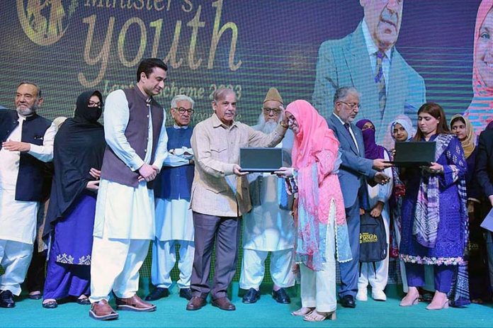 Prime Minister Muhammad Shehbaz Sharif distributes laptops among the high achievers of public sector universities under the PM’s Youth Laptop Scheme