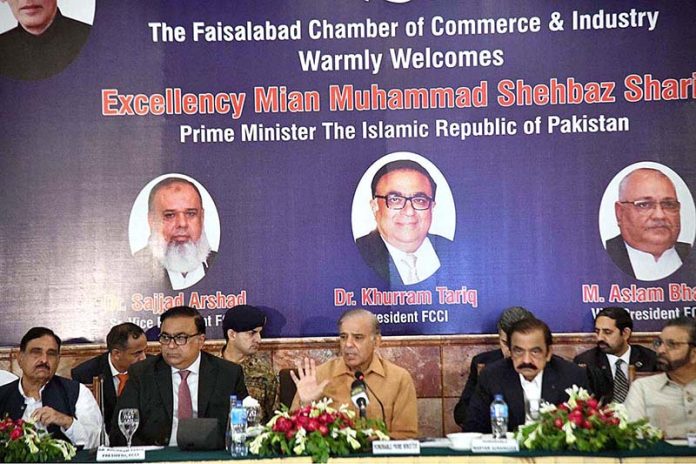 Prime Minister Muhammad Shehbaz Sharif addresses the members of the Faisalabad Chamber of Commerce and Industries