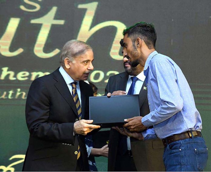 Prime Minister Muhammad Shehbaz Sharif distributes laptops among the high achievers of public sector universities of Sindh under PM's Youth Laptop Scheme 2023 at Governor House