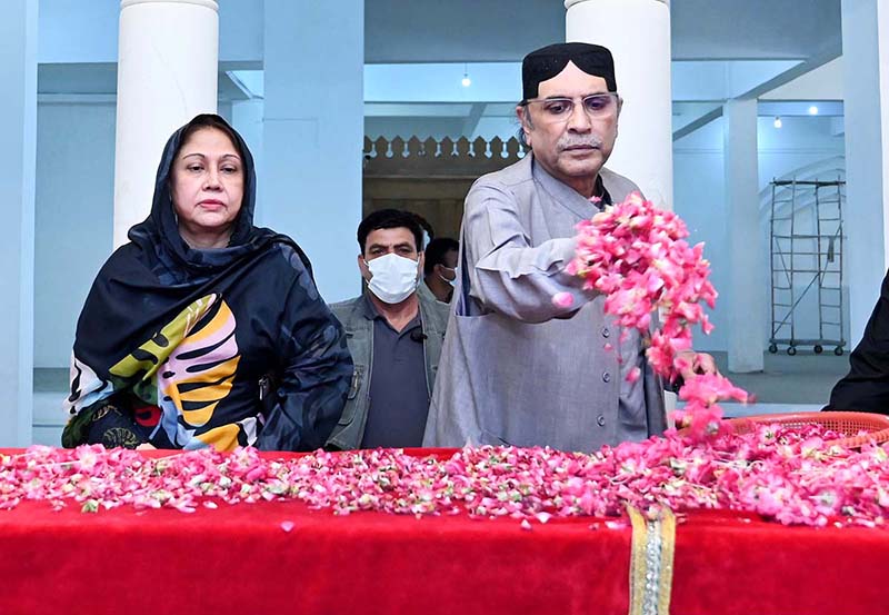 Former President of Pakistan Asif Ali Zardari along with MPA Faryal Talpur showering flowers at the grave of Shaheed Zulfikar Ali Bhutto at Garhi Khuda Bakhsh Bhutto