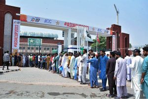 A large number of spectators standing in queue to enter the Multan Cricket Stadium for first cricket match of Asia Cup 2023 between Pakistan and Nepal