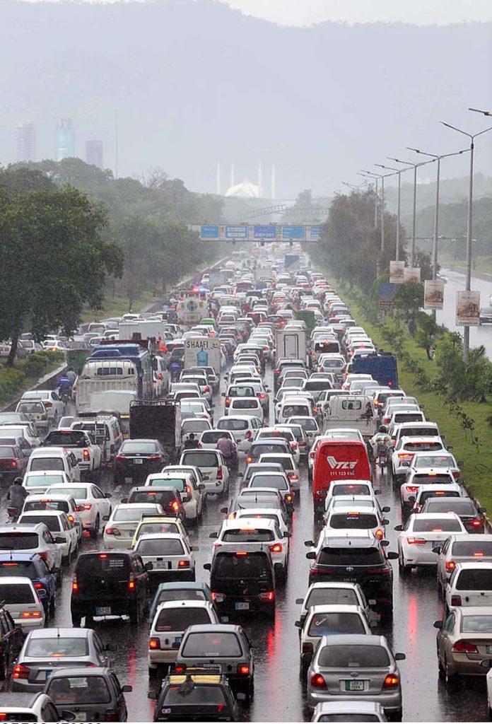 A view of massive traffic jam at Islamabad Expressway during rain that experienced the Federal Capital