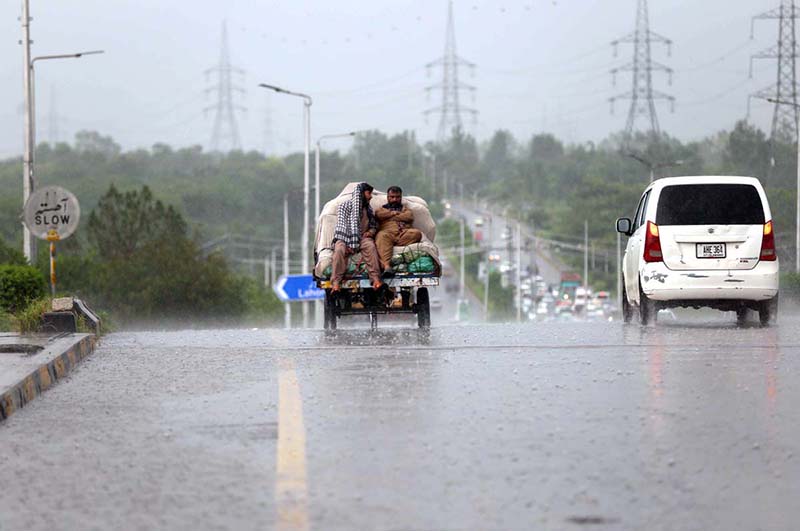 A view of massive traffic jam at Islamabad Expressway during rain that experienced the Federal Capital